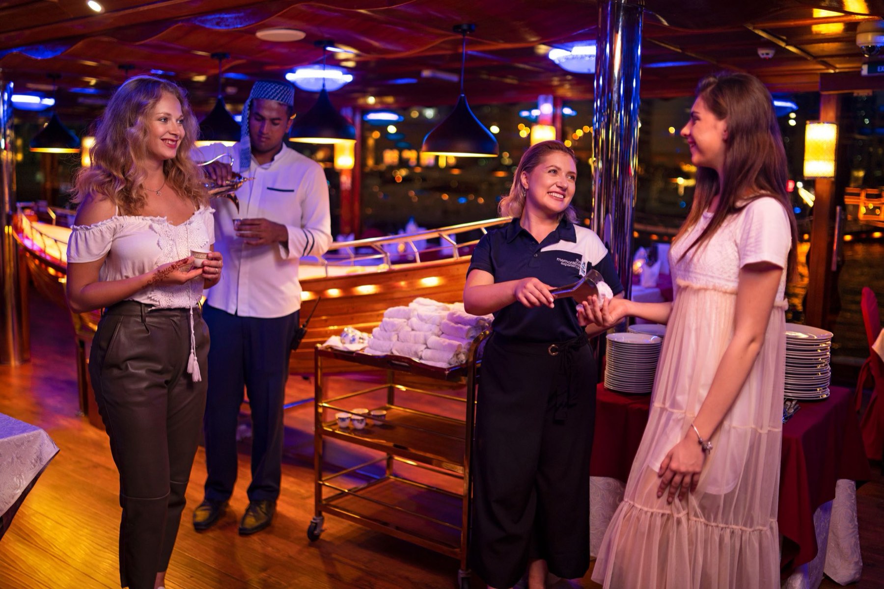 Crew welcoming guests aboard with refreshments